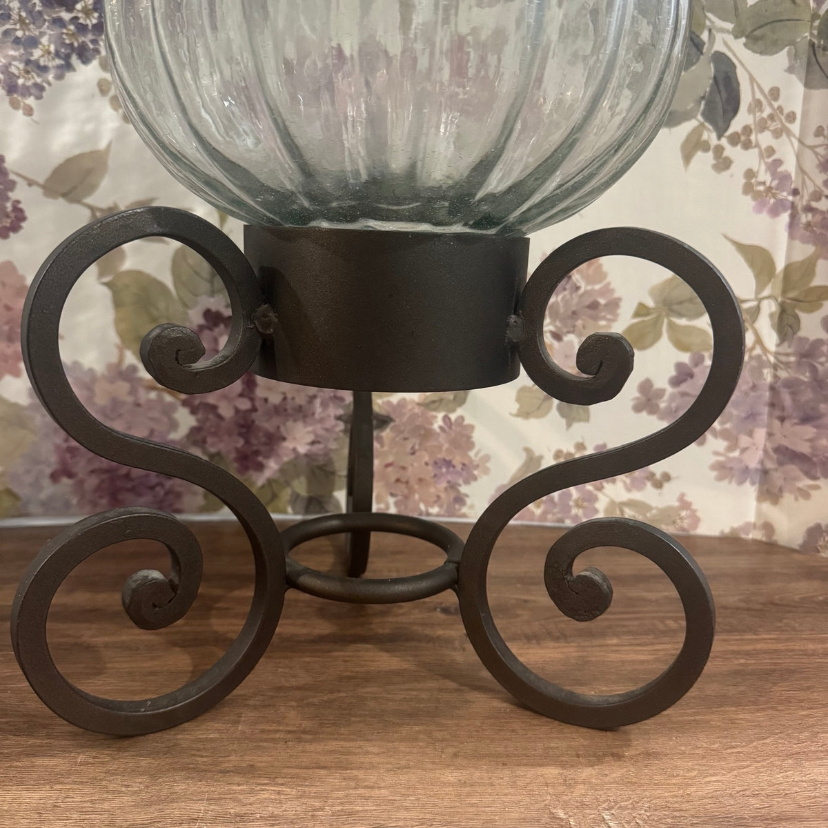 Large Glass Hurricane Vase on Wrought Iron Scroll Stand