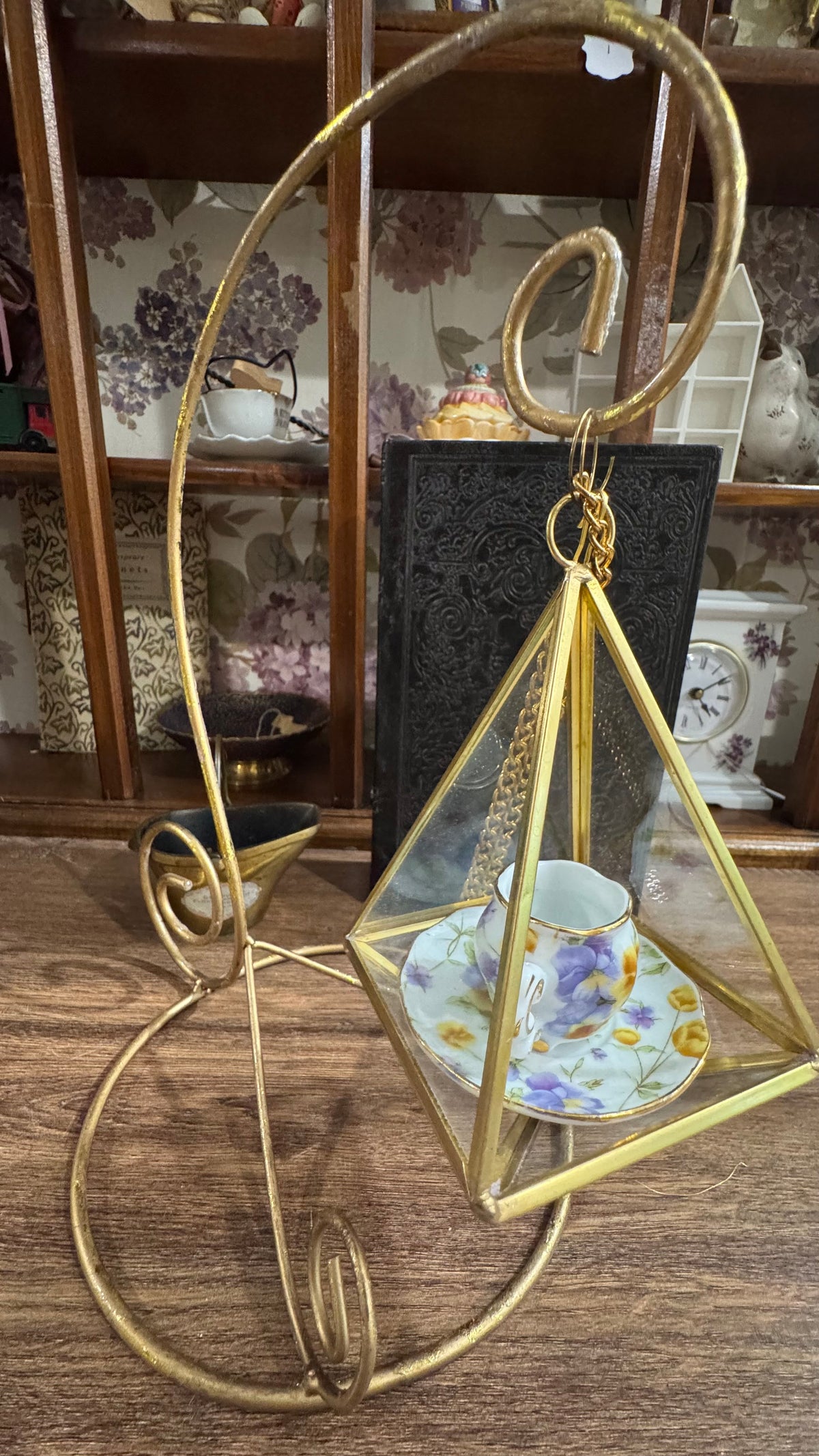 Gold Scroll Display Stand with Hanging Geometric Glass Terrarium